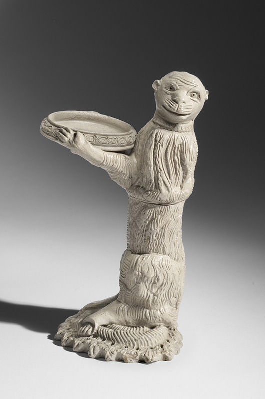Monkey Bearing a Dish (Sand Holder from a Writing Set), c. 1750. Artist/maker unknown, German. Salt-glazed stoneware, 6 5/8 × 4 × 3 9/16 inches (16.8 × 10.2 × 9 cm). Promised gift of Charles W. Nichols.